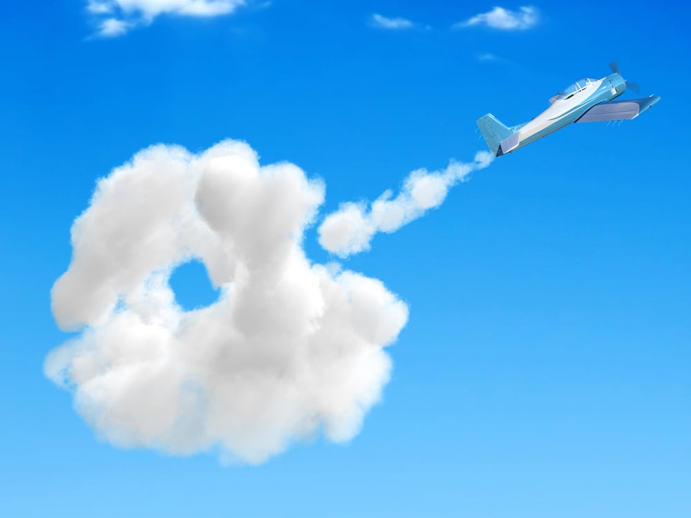 3D airplane flying in the sky and going through a cloud